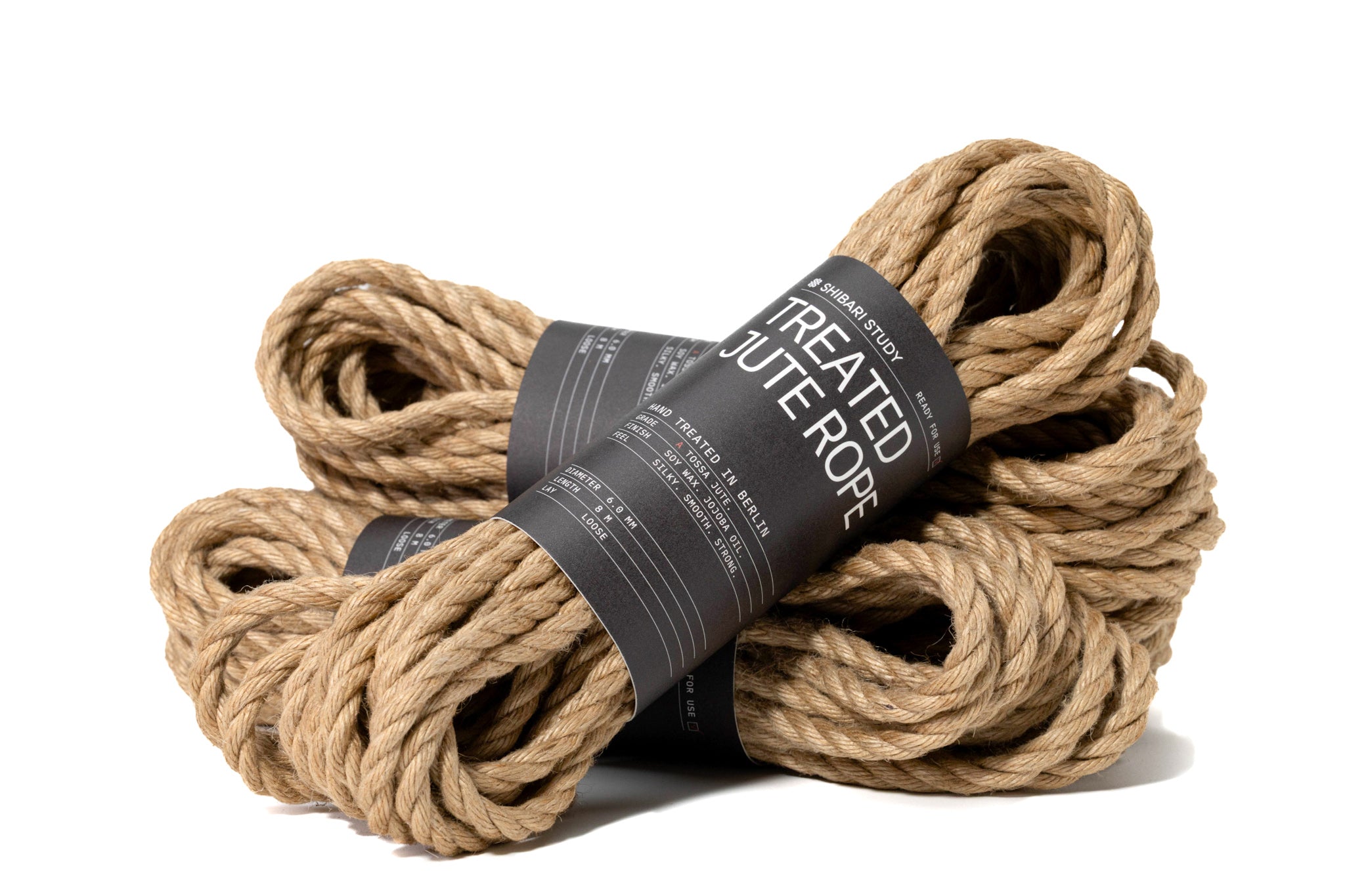 Two rolls of treated jute rope with a label on a white background