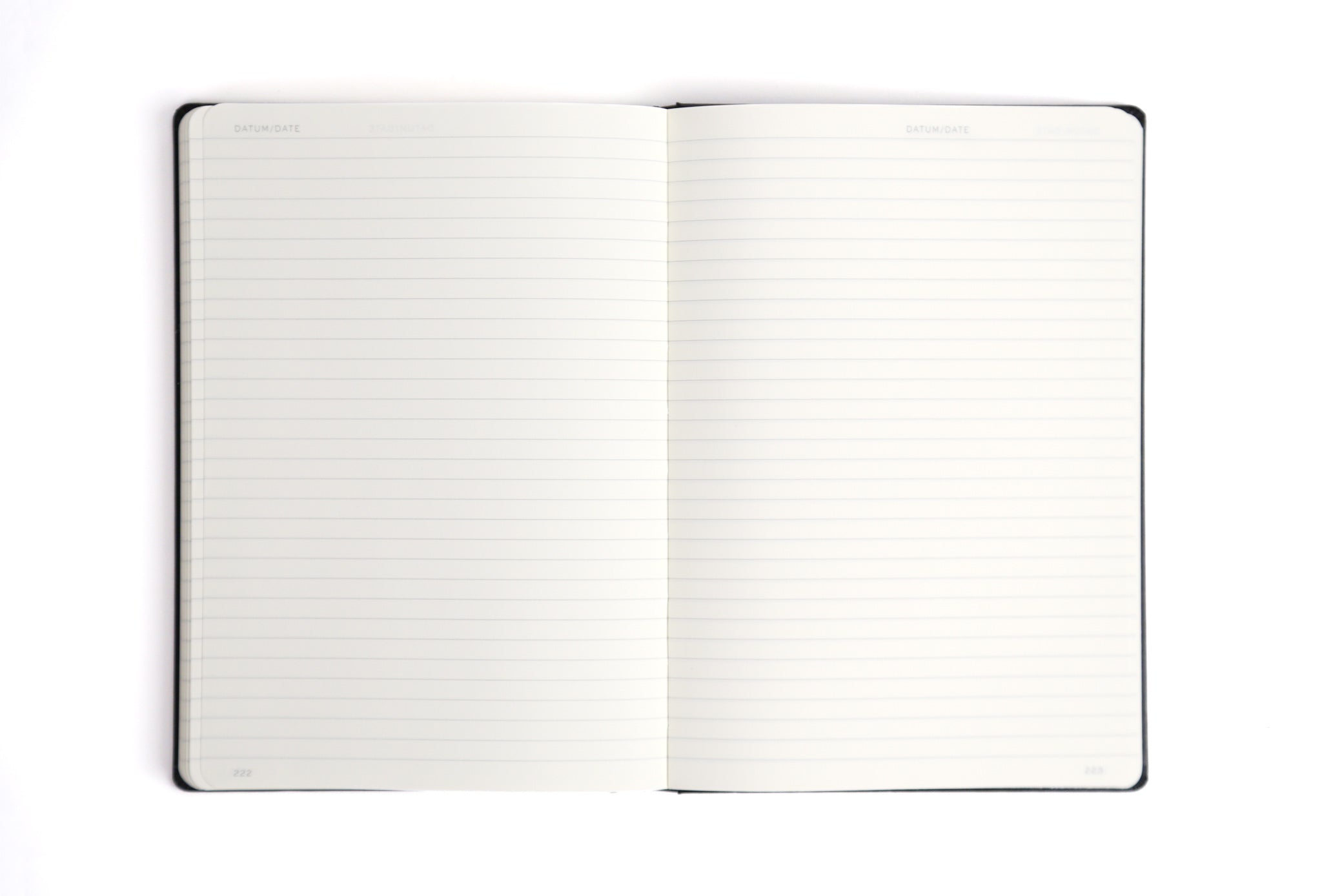 Open notebook with lined pages on a white background