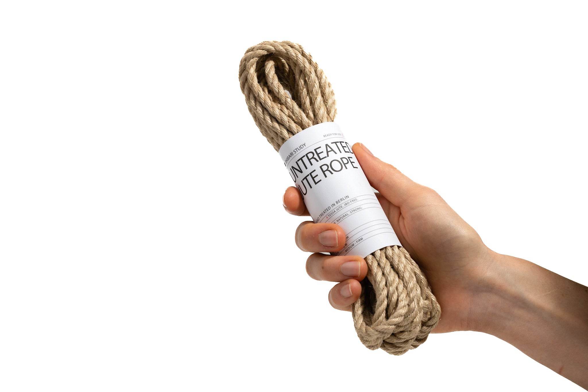 Hand holding a bundle of rope with a label on a white background